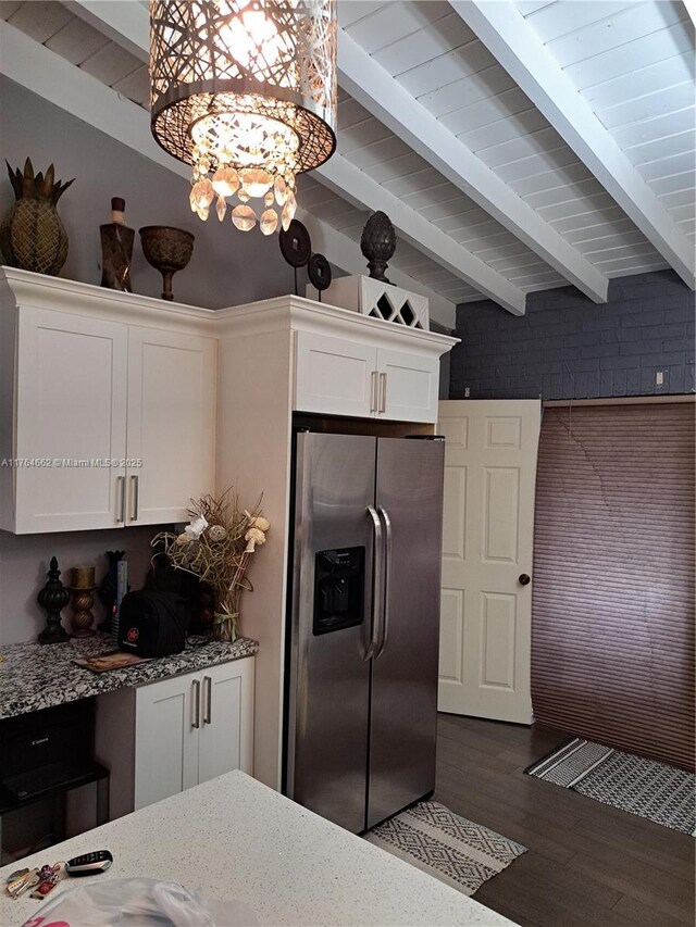 911 W Country Club Cir, Plantation, FL 33317 - kitchen featuring white cabinetry, beam ceiling, light stone countertops, and stainless steel fridge