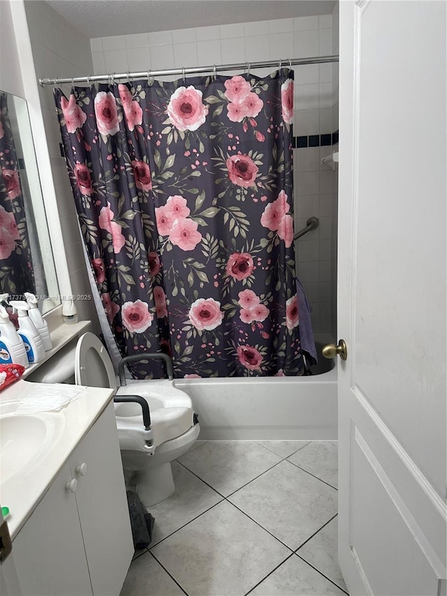 bathroom featuring tile patterned floors, toilet, vanity, and shower / bath combination with curtain