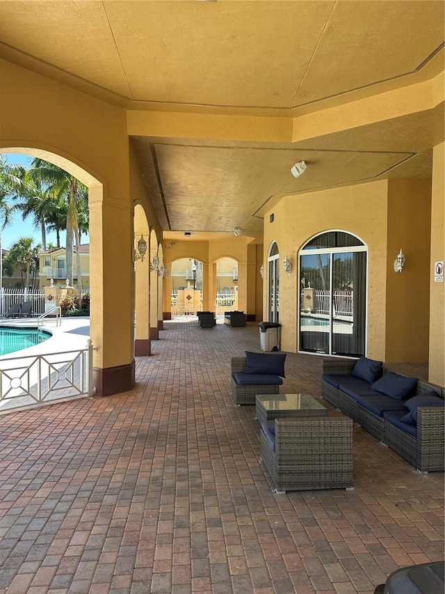 view of patio / terrace with an outdoor pool and an outdoor hangout area