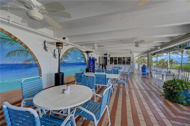 exterior space with ceiling fan and outdoor dining area