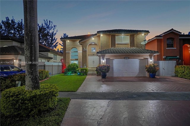 13021 NW 11th Ter, Miami, FL 33182 - view of front of property featuring fence, a tile roof, stucco siding, decorative driveway, and an attached garage