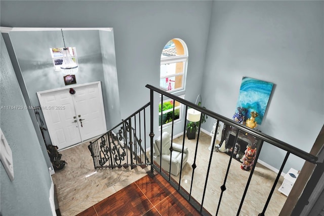 13021 NW 11th Ter, Miami, FL 33182 - staircase with baseboards and a chandelier