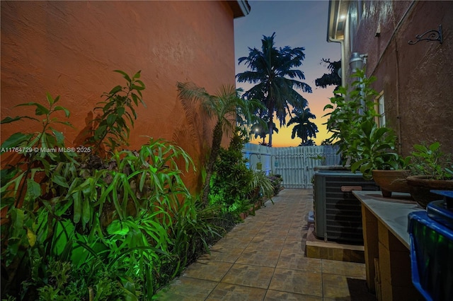 13021 NW 11th Ter, Miami, FL 33182 - patio terrace at dusk with central air condition unit and fence