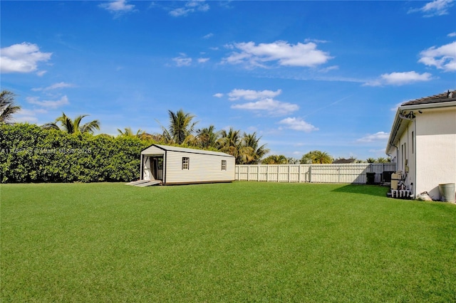 view of yard with an outdoor structure and fence