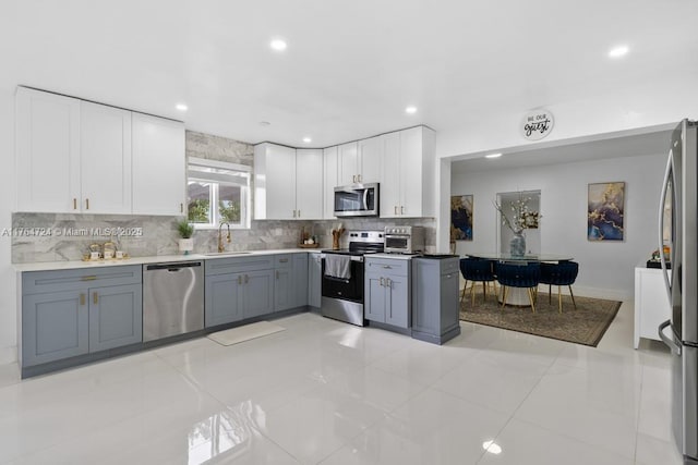 10341 SW 150th Ter, Miami, FL 33176 - kitchen with tasteful backsplash, recessed lighting, stainless steel appliances, white cabinetry, and a sink