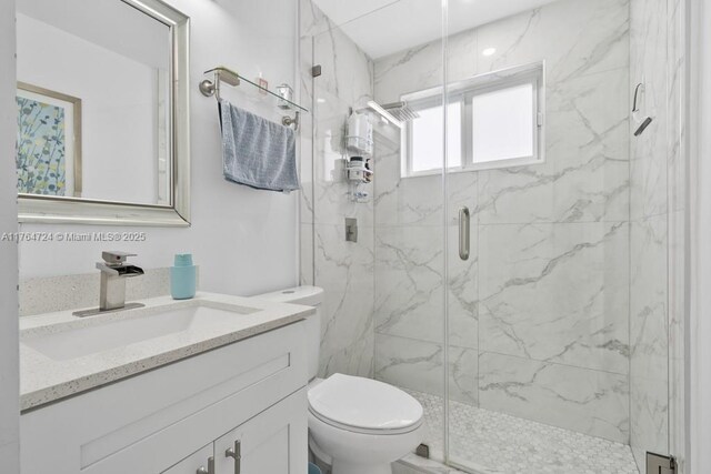 10341 SW 150th Ter, Miami, FL 33176 - bathroom with vanity, toilet, and a marble finish shower