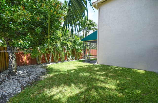 view of yard with a fenced backyard