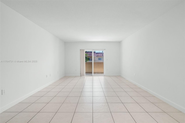 9952 SW 88th St Unit 9952, Miami, FL 33176 - spare room with light tile patterned floors and baseboards