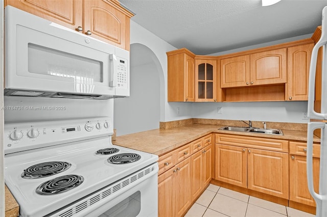 9952 SW 88th St Unit 9952, Miami, FL 33176 - kitchen with white appliances, a sink, light countertops, light tile patterned flooring, and a textured ceiling