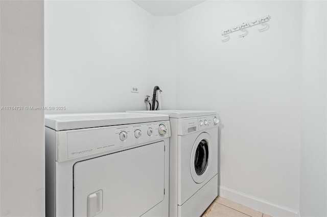 9952 SW 88th St Unit 9952, Miami, FL 33176 - laundry area featuring independent washer and dryer and light tile patterned flooring
