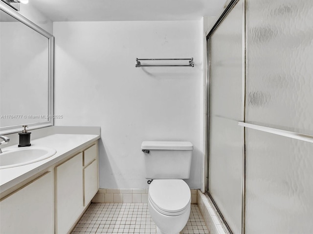 900 NE 195th St Unit 504, Miami, FL 33179 - bathroom featuring tile patterned floors, an enclosed shower, toilet, and vanity