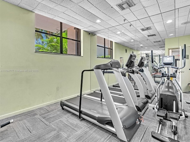900 NE 195th St Unit 504, Miami, FL 33179 - workout area with baseboards, visible vents, and a drop ceiling