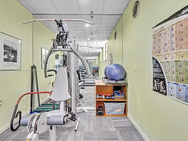 900 NE 195th St Unit 504, Miami, FL 33179 - exercise area featuring a drop ceiling, baseboards, visible vents, and carpet flooring