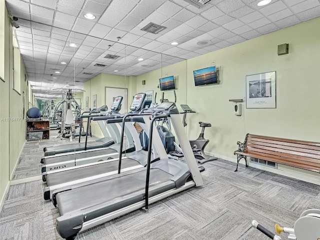 900 NE 195th St Unit 504, Miami, FL 33179 - workout area featuring carpet flooring, a paneled ceiling, visible vents, and baseboards
