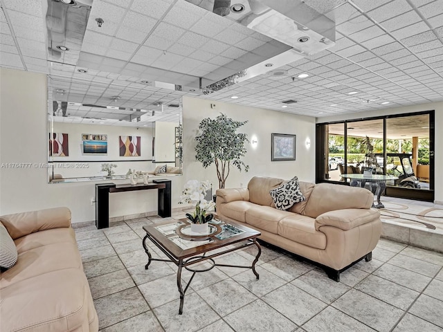 900 NE 195th St Unit 504, Miami, FL 33179 - living room with a paneled ceiling and tile patterned flooring