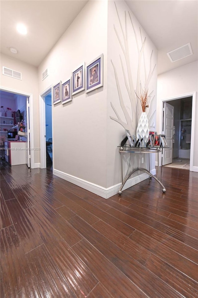 747 NE 193rd Ter, Miami, FL 33179 - hallway with visible vents, baseboards, and wood finished floors