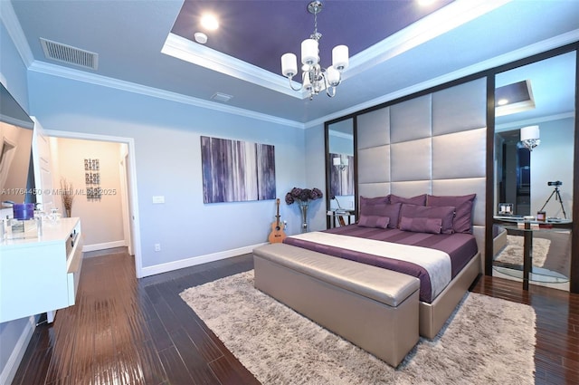 747 NE 193rd Ter, Miami, FL 33179 - bedroom with dark wood finished floors, a tray ceiling, crown molding, and visible vents
