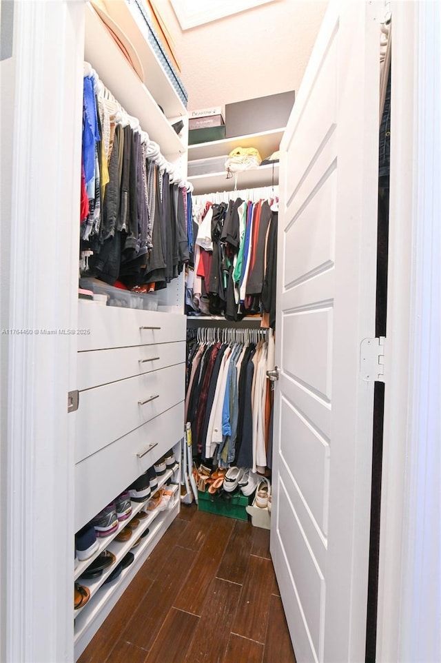 747 NE 193rd Ter, Miami, FL 33179 - spacious closet with dark wood-style flooring
