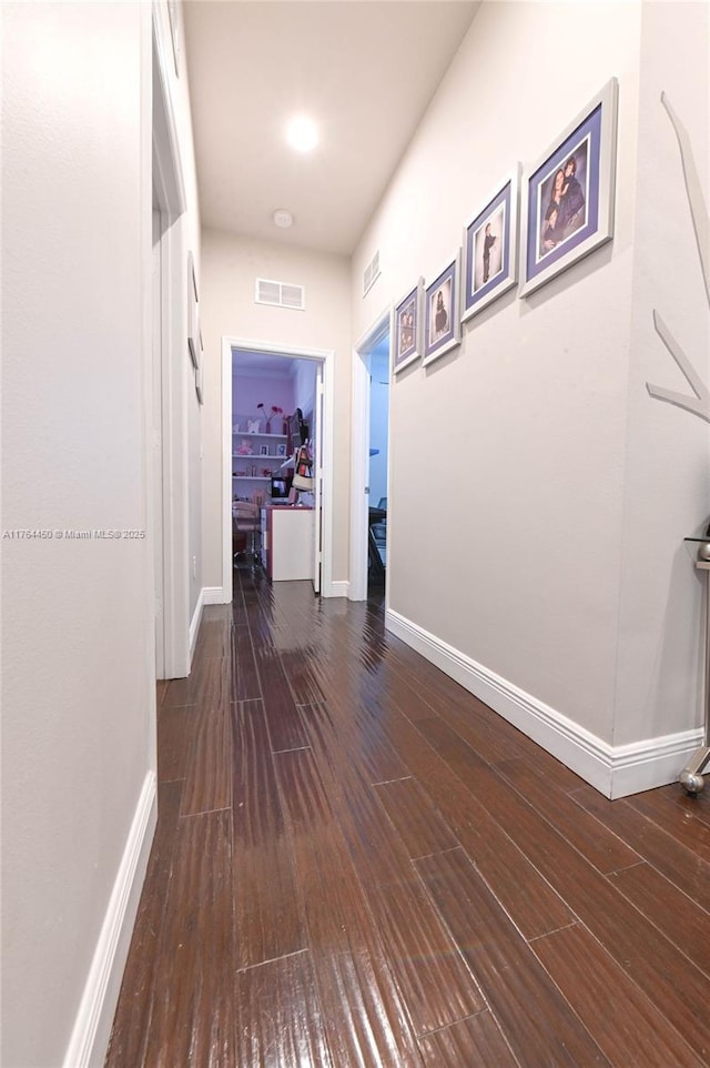 747 NE 193rd Ter, Miami, FL 33179 - hall with visible vents, baseboards, and wood finished floors