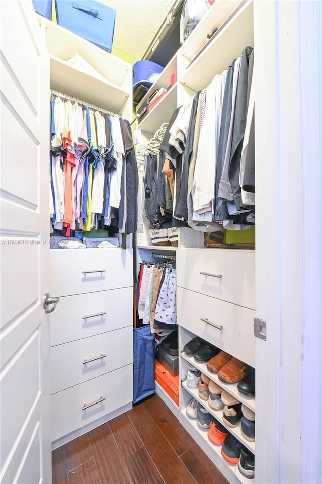 747 NE 193rd Ter, Miami, FL 33179 - spacious closet featuring dark wood finished floors