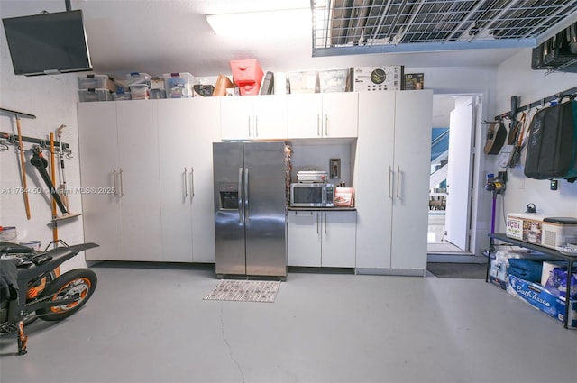 747 NE 193rd Ter, Miami, FL 33179 - garage featuring stainless steel refrigerator with ice dispenser