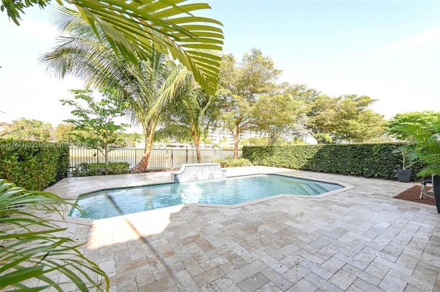 747 NE 193rd Ter, Miami, FL 33179 - view of pool featuring a fenced in pool, a patio, and a fenced backyard