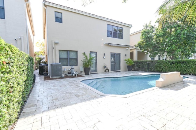 747 NE 193rd Ter, Miami, FL 33179 - view of swimming pool with a patio area, a fenced in pool, central AC, and fence