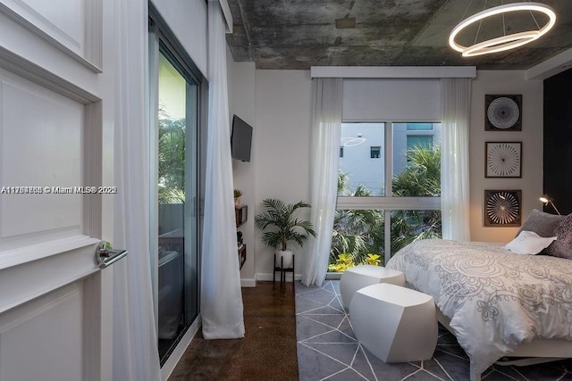 bedroom with a notable chandelier