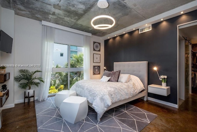 bedroom featuring an inviting chandelier, baseboards, and visible vents