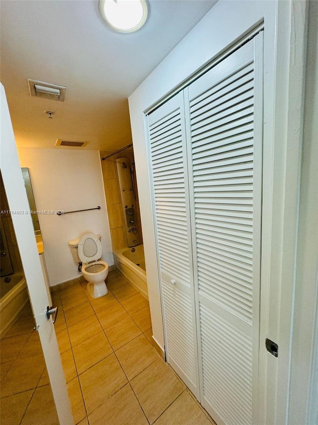 1750 N Bayshore Dr Unit 1606, Miami, FL 33132 - bathroom featuring toilet, tile patterned flooring, shower / bathtub combination, baseboards, and a closet