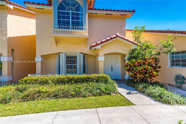 11063 SW 152nd Ct, Miami, FL 33196 - doorway to property with stucco siding and a tile roof