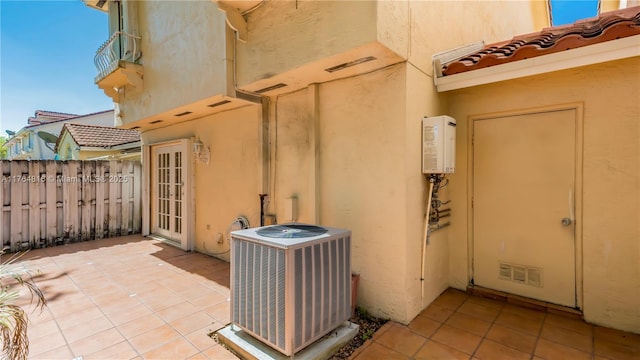 11063 SW 152nd Ct, Miami, FL 33196 - view of patio with visible vents, cooling unit, a balcony, and fence