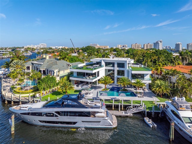 exterior space featuring a water view and a view of city