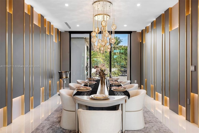 dining area featuring recessed lighting, a chandelier, and expansive windows