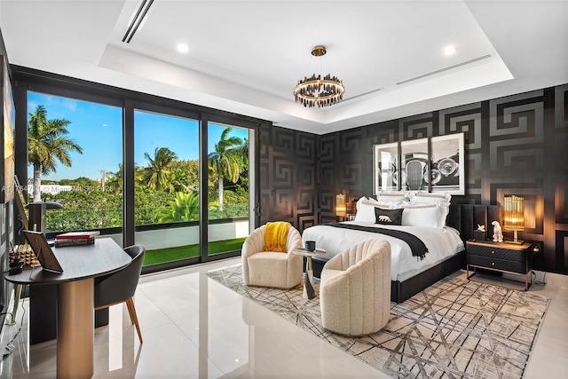 bedroom featuring wallpapered walls, a tray ceiling, light tile patterned floors, and a chandelier