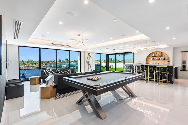 game room featuring a community bar, visible vents, billiards, and a tray ceiling