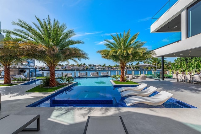 view of swimming pool with a patio