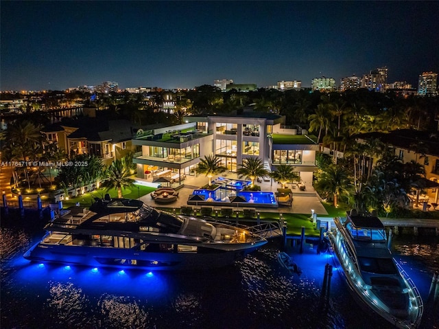 aerial view at twilight with a water view