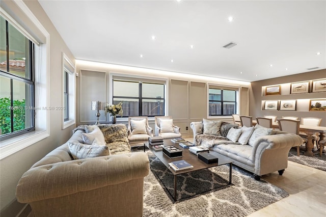 9835 NW 86th Ter, Doral, FL 33178 - living room featuring visible vents and a decorative wall