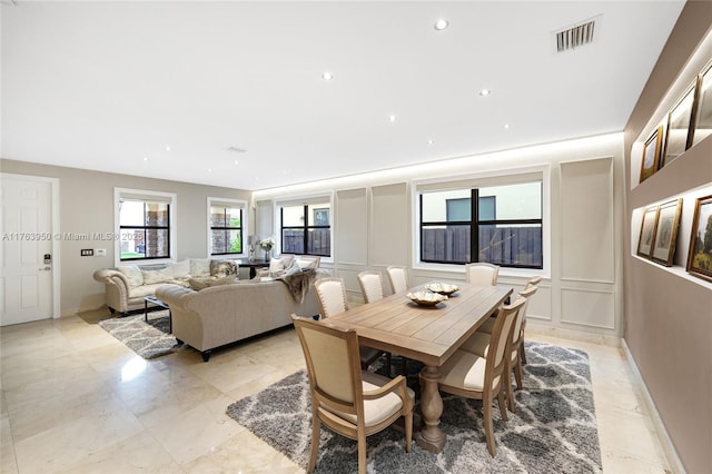 9835 NW 86th Ter, Doral, FL 33178 - dining space with a decorative wall, recessed lighting, visible vents, and baseboards