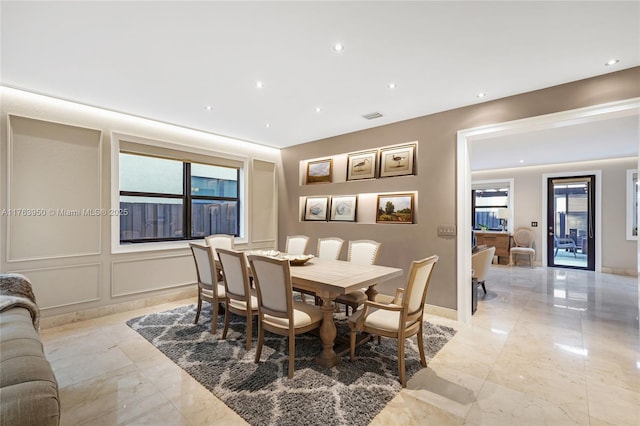 9835 NW 86th Ter, Doral, FL 33178 - dining area with a decorative wall, recessed lighting, visible vents, and marble finish floor