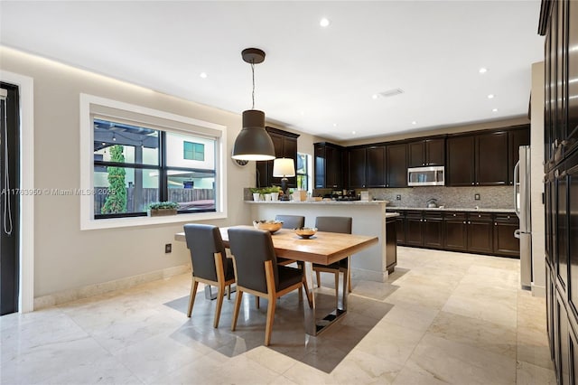 9835 NW 86th Ter, Doral, FL 33178 - dining room with recessed lighting and baseboards