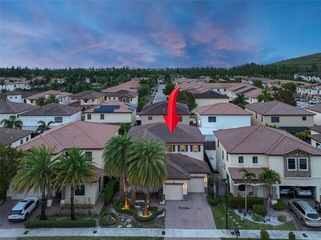 9835 NW 86th Ter, Doral, FL 33178 - aerial view at dusk featuring a residential view