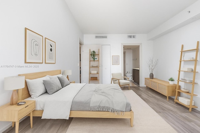 801 S Miami Ave Unit 3110, Miami, FL 33130 - bedroom featuring wood finished floors and ensuite bathroom