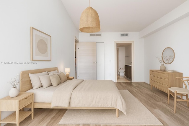 801 S Miami Ave Unit 3110, Miami, FL 33130 - bedroom with light wood finished floors and ensuite bathroom