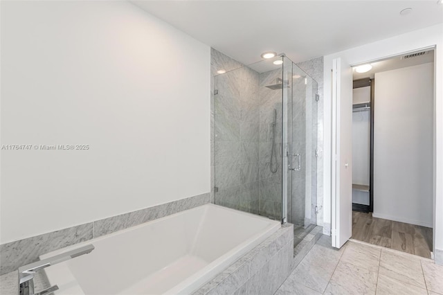 801 S Miami Ave Unit 3110, Miami, FL 33130 - full bath featuring a garden tub, a shower stall, a spacious closet, and recessed lighting
