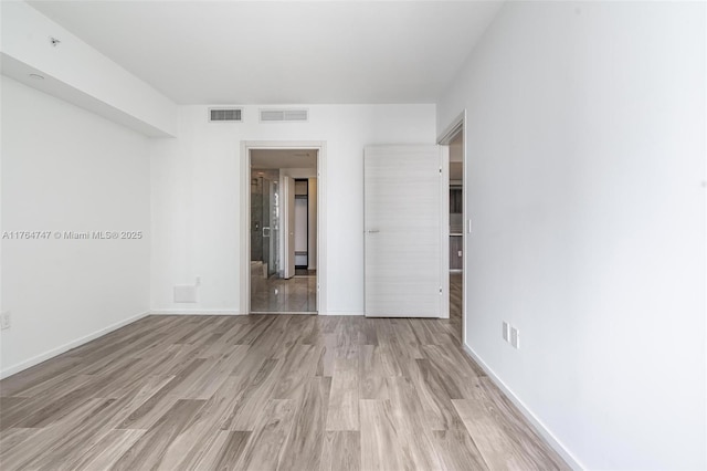 801 S Miami Ave Unit 3110, Miami, FL 33130 - unfurnished bedroom featuring light wood-type flooring and baseboards