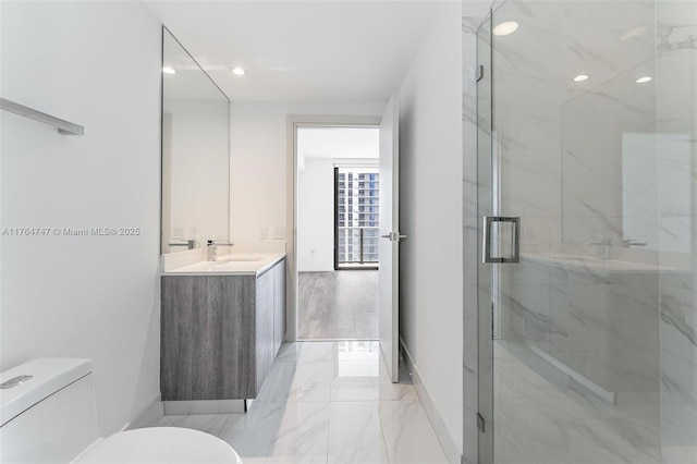 801 S Miami Ave Unit 3110, Miami, FL 33130 - bathroom featuring vanity, marble finish flooring, a marble finish shower, and recessed lighting