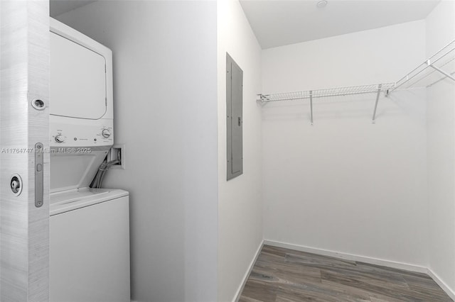 801 S Miami Ave Unit 3110, Miami, FL 33130 - washroom with estacked washer and dryer, electric panel, and wood finished floors