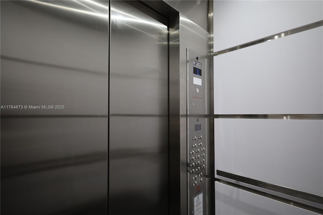 interior details with elevator and a package area